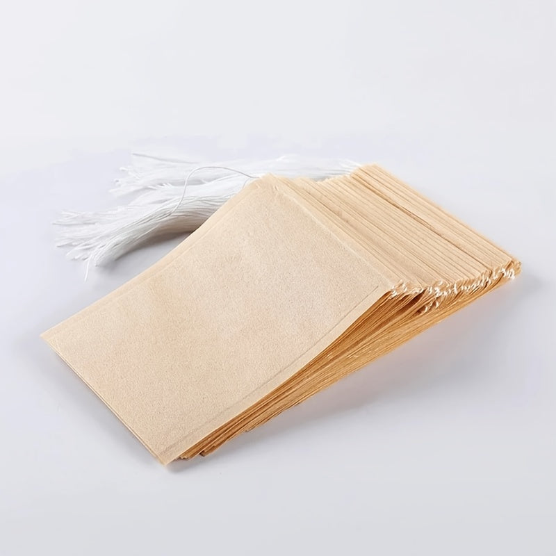 100pcs Natural Biodegradable Drawstring Filter Paper Bags for Coffee, Tea, and Food - Safe and  - Disposable Tea Brewer and Empty Tea Bag with Pine Leaf Powder and Herbs - Perfect for Brewing and Serving