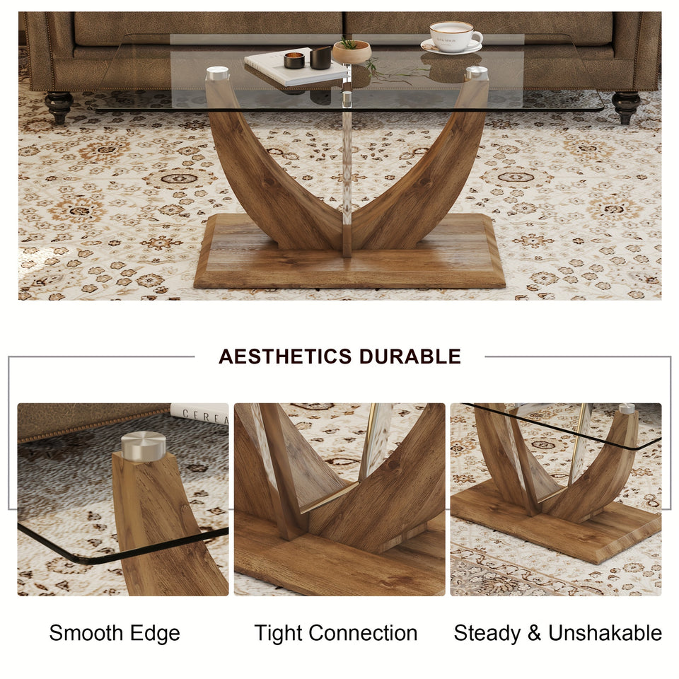 Modern minimalist transparent tempered glass coffee table with wooden legs and stainless steel decorative columns. Computer desk. Game table.