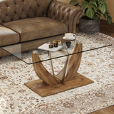 Modern minimalist transparent tempered glass coffee table with wooden legs and stainless steel decorative columns. Computer desk. Game table.